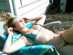 Teen Veronica tanning getting hot and topless in her garden